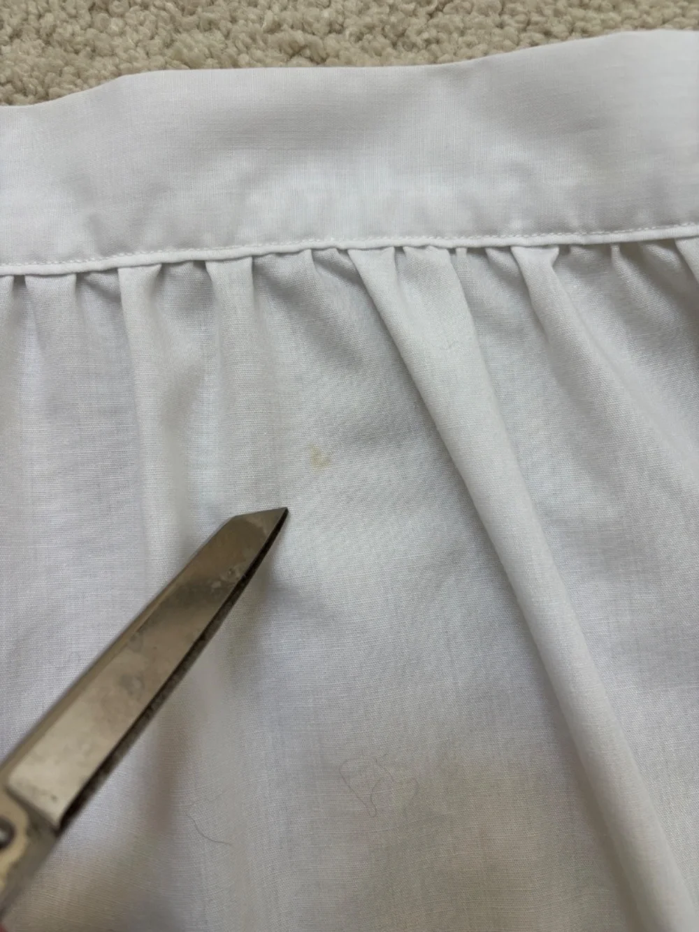 Vintage white half apron featuring hand-stitched cross-stitch Christmas trees